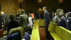 Oscar Pistorius in court: 'Stone-faced' as trial is delayed